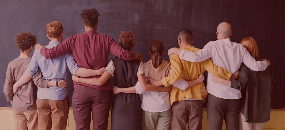 a group of people standing around each other