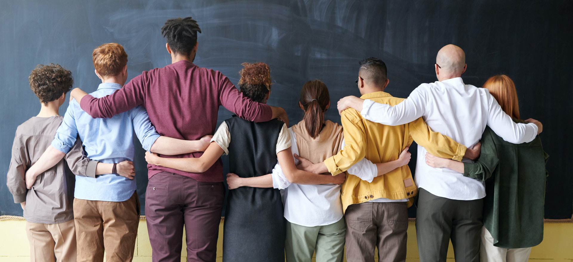a group of people standing in front of a crowd