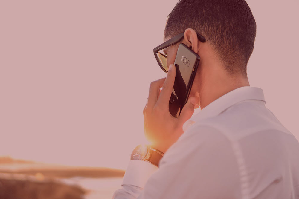 a man talking on a cell phone